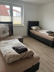 En eller flere senge i et værelse på Ferienwohnung Bettina