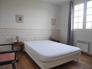 Postel nebo postele na pokoji v ubytování Le jardin de la plage