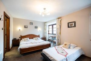 Postel nebo postele na pokoji v ubytování Hôtel Berceau Du Vigneron