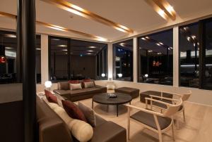 a living room with a couch and a table at Yuki Sugi at Intuition in Kutchan +16 photos