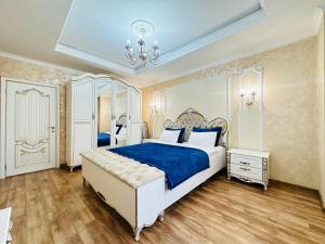 Katil atau katil-katil dalam bilik di Mega Tower Almaty, a residential complex