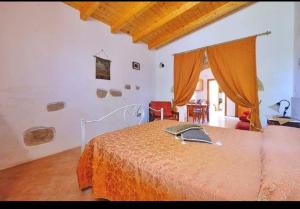 A bed or beds in a room at Masseria Bianca