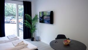 TV i/ili multimedijalni sistem u objektu A Hotels Apartments Høje Taastrup