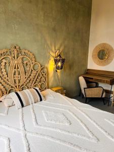 a bedroom with a white bed and a piano at Apartement Wabi Sabi w centrum Raciborza in Racibórz +14 photos