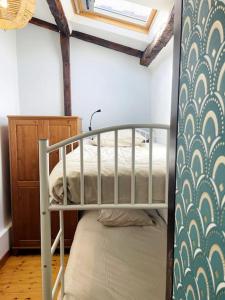 a bedroom with a bunk bed in a room at Le Chaîne - Vieux port centre in La Rochelle