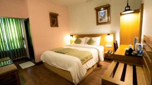 Voodi või voodid majutusasutuse HillView Munnar toas