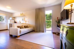Cama ou camas em um quarto em Zur Suítes