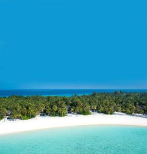 an island in the ocean with white sand and trees at One&Only Reethi Rah in Reethi Rah