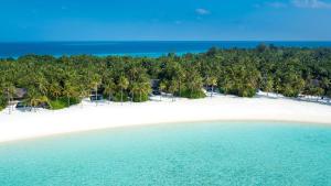 an aerial view of a beach with palm trees at One&Only Reethi Rah in Reethi Rah