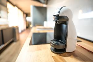 a hair dryer sitting on top of a wooden table at Apartamento Con Jardín Rodeado de Viñedos in Ribadumia