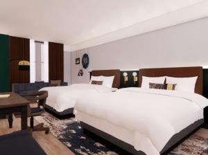 Hotel Indigo West Chester - Downtown by IHG客房内的一张或多张床位