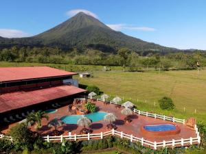 an aerial view of a resort with a mountain in the background at Hotel La Pradera del Arenal in Fortuna