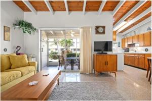 a living room with a couch and a table at Casa Mar By Beachside Management in Sarasota