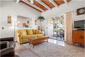 a living room with a couch and a table at Casa Mar By Beachside Management in Sarasota