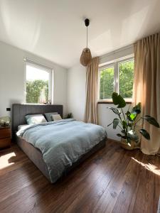Postel nebo postele na pokoji v ubytování Apartament w stylu boho 60m2