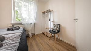 Postel nebo postele na pokoji v ubytování WineDesign Boxspring 8 Pers BASF Nähe Ludwigshafen und Mannheim