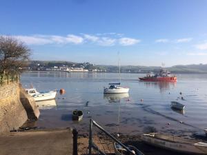 a group of boats in a body of water at Stables A delightful one bed cottage with parking! in Appledore