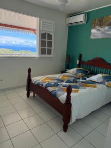 Postel nebo postele na pokoji v ubytování VILLA C'MARGOT
