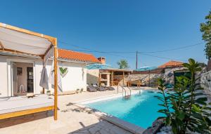 an image of a villa with a swimming pool at Nice Home In Zemunik Donji With Kitchen in Smrdelje