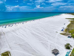 an aerial view of a beach with people and the ocean at Jamaica Royale Beachfront Tower in Siesta Key
