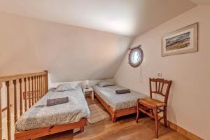 Ένα ή περισσότερα κρεβάτια σε δωμάτιο στο Ty Forn - Maison à 10min des plages