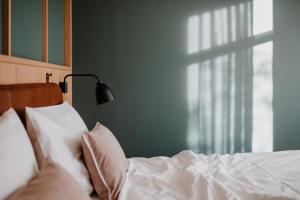 Posteľ alebo postele v izbe v ubytovaní VillaVerde Aparthotel