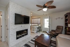 a living room with a fireplace with a flat screen tv at Sea Club II in Siesta Key