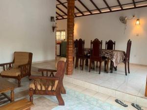 a dining room with a table and chairs at No 36 Surf Paradise Apartment in Matara