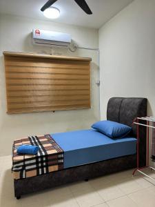a hospital room with a bed with a ventilator on the wall at Ruzarani Home Meru Suria in Chemor