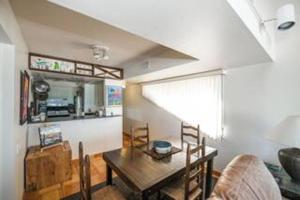 a living room with a table and a couch at Fanta-Sea 47 By Beachside Management in Siesta Key