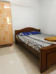A bed or beds in a room at Forest Stay By Shivalaya Coimbatore