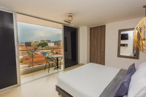 Voodi või voodid majutusasutuse Hotel Perlatto toas