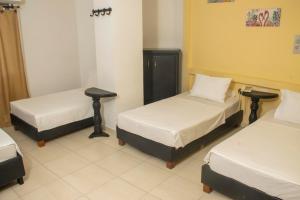 Postel nebo postele na pokoji v ubytování Hotel Central