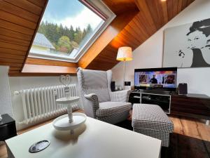 TV a/nebo společenská místnost v ubytování Aixpress Apartment