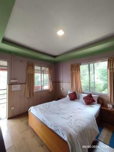 Llit o llits en una habitació de Hotel Mount Paradise