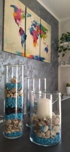 a vase filled with rocks and a candle on a table at B&B La Munachell in Vieste