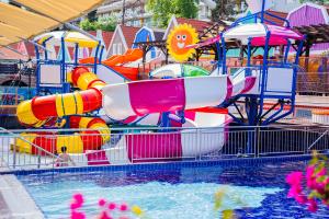 a water park with a bunch of water slides at Orange County Kemer Family Only in Kemer