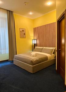 Postel nebo postele na pokoji v ubytování Hotel Rome place