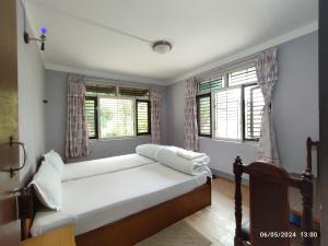 Llit o llits en una habitació de Hotel Mount Paradise