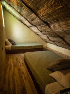 a bedroom with two beds and a bunk bed at Jungla EcoLuxury Resort in Villeta