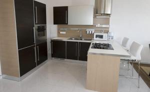 a kitchen with a sink and a counter top at Apartments Gudelj in Podgora