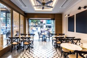 a restaurant with tables and chairs in front of a window at Arcade Hotel & SPA Nisantasi in Istanbul +49 photos