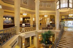 a large lobby with a staircase in a building at Hilton Grand Vacation Club The Boulevard in Las Vegas