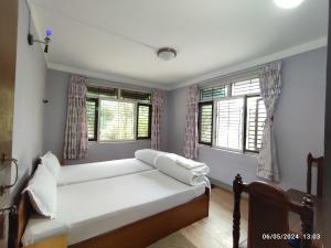 Llit o llits en una habitació de Hotel Mount Paradise