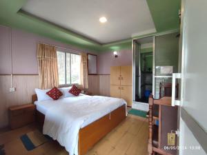 Llit o llits en una habitació de Hotel Mount Paradise