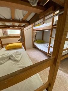 Postel nebo postele na pokoji v ubytování Hostel Sol da Barra