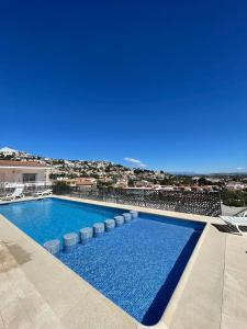 a swimming pool with a view of a city at Alpen1 Finca Simo in Peniscola