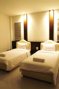 Katil atau katil-katil dalam bilik di Saabpaiboon Grand Resort