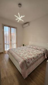 Ένα ή περισσότερα κρεβάτια σε δωμάτιο στο Casa&Mare
