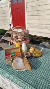 a picnic with bread and other food on a table at Abbeyview House in Abbeyshrule